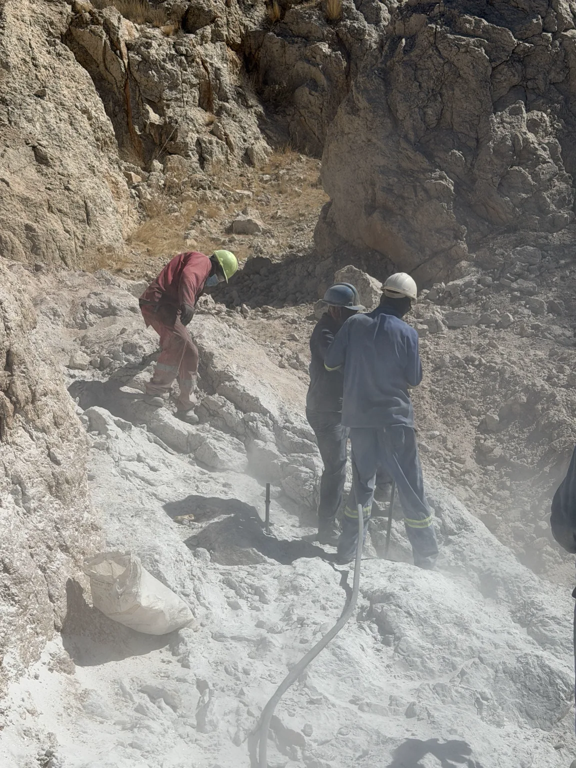 The Manger Mining drilling crew working in dust at the mine